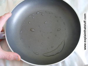 A frying pan coated with nonstick Teflon, a plastic polymer